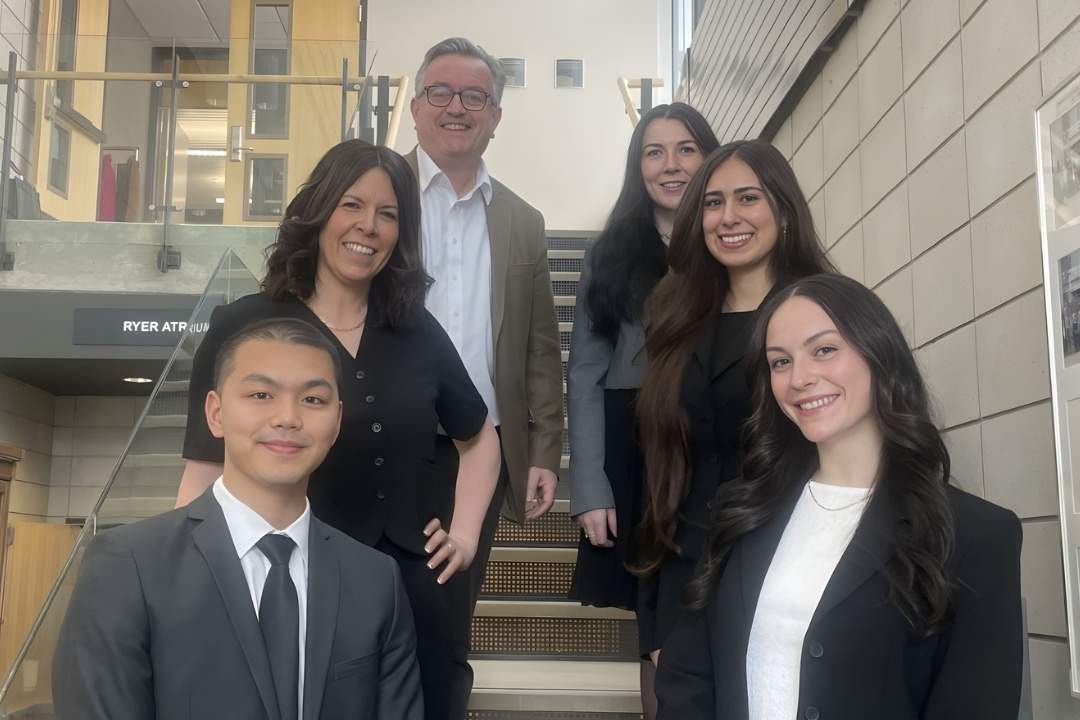 Dean's Forum students, course instructor and program facilitator, and Dean of the College of Law stand together for a photo.
